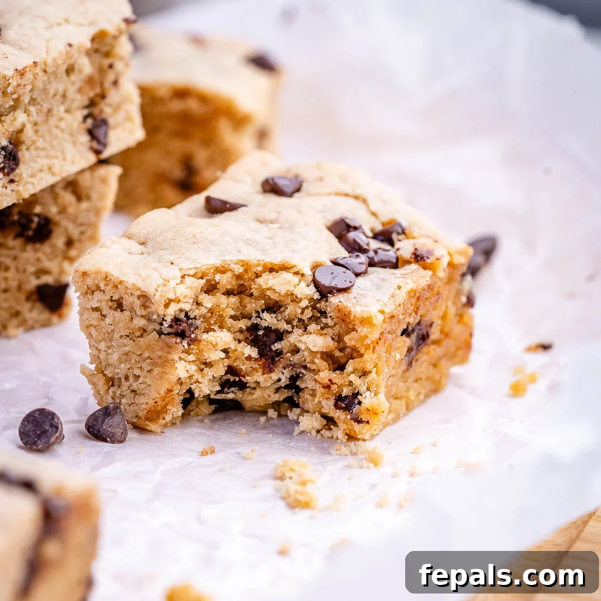 Soft Chewy Chocolate Chip Cookie Bars Recipe 8 a single bar with a bite taken off it.