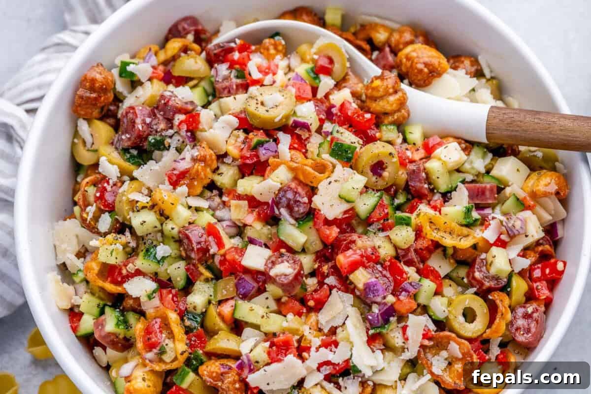Crispy Air Fryer Pasta Salad with Zesty Herbs 7 crispy pasta salad in a bowl with a spoon in it.