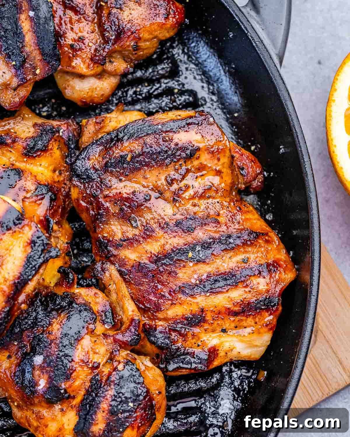 grilled chicken thighs on a grill pan.