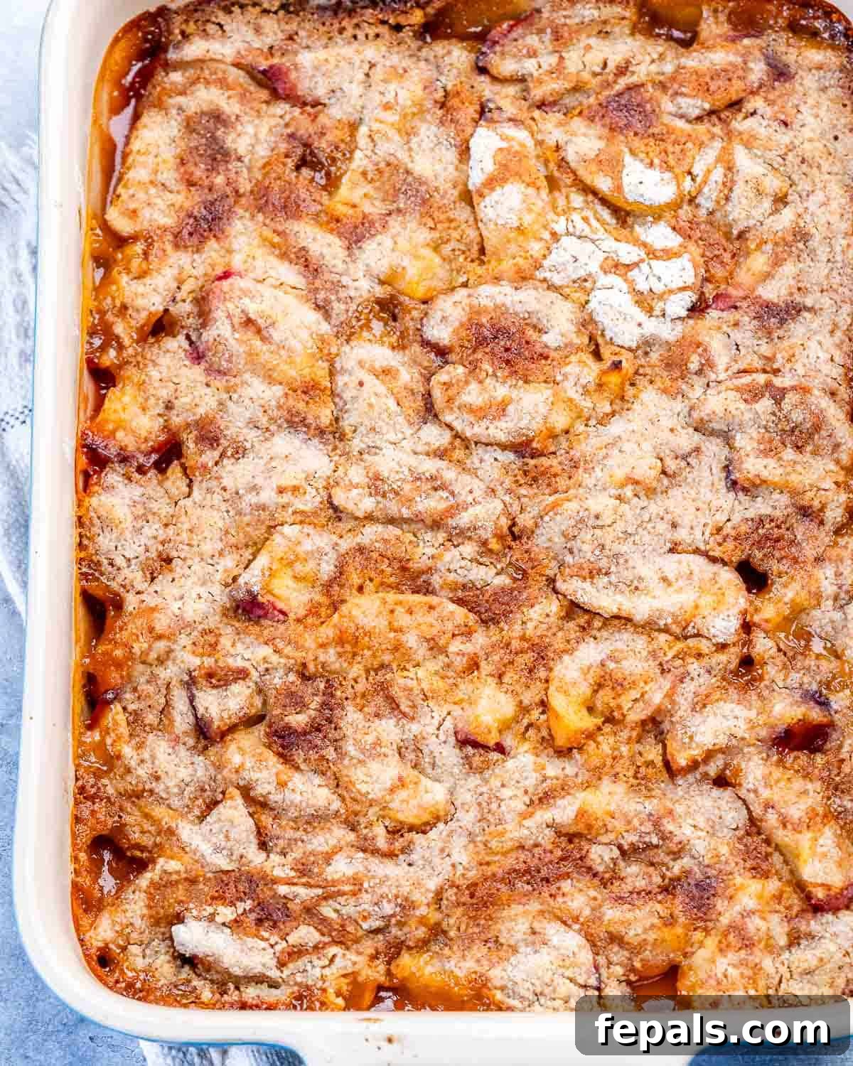 Fresh Peach Dump Cake Recipe with Ripe Peaches 7 A baking dish with peach dump cake