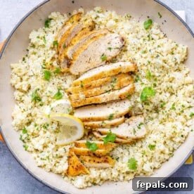 25 Chicken Meal Prep Recipes for Quick, Flavorful Weeknight Meals 25 top view cauliflower rice in a skillet with sliced chicken breast