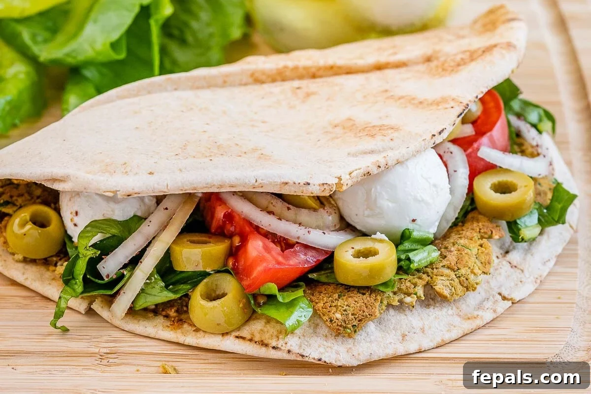 smash falafel pita on a cutting board.