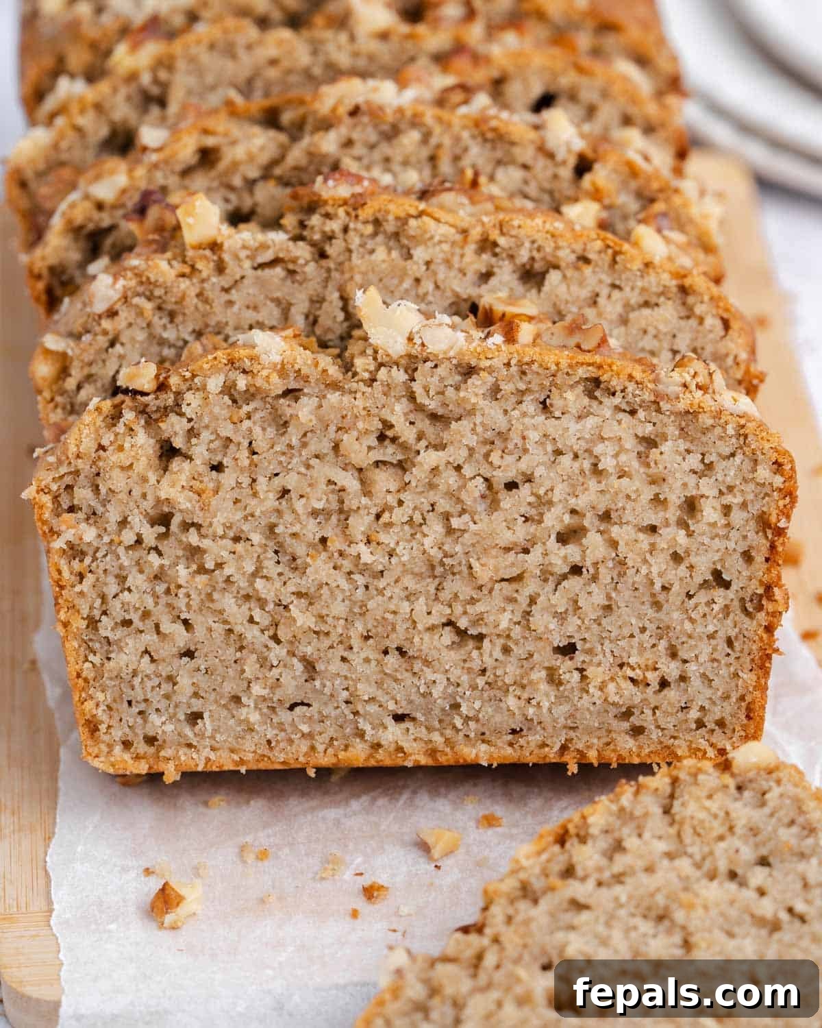 sliced applesauce bread on a cutting board.