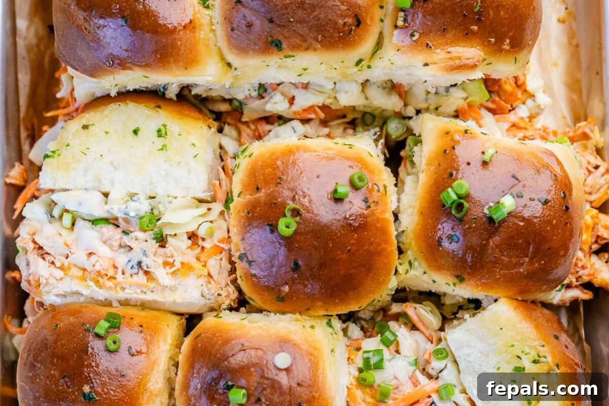 Buffalo chicken slider buns baked and laid out.