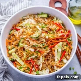 a bowl of crispy rice salad with veggies.