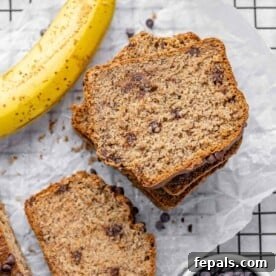 top view sliced banana bread stacks with a side of banana