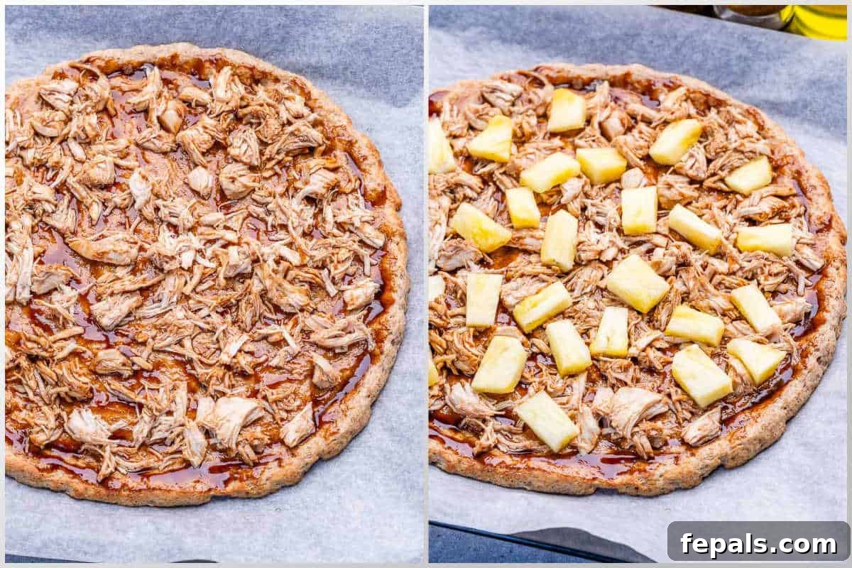 process shot of adding shredded chicken and pineapple over the bbq sauce and dough.