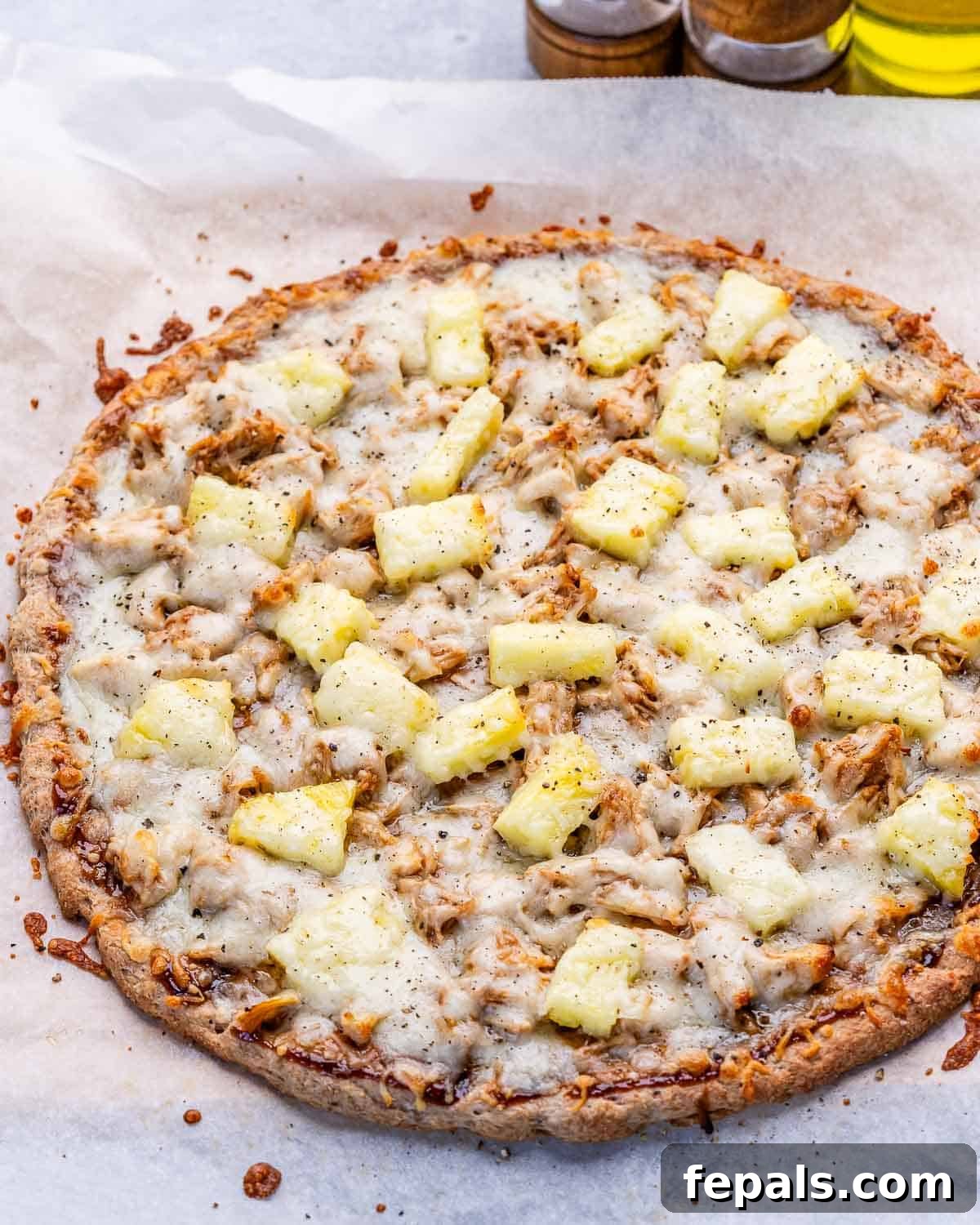 Whole baked BBQ chicken pizza before slicing.