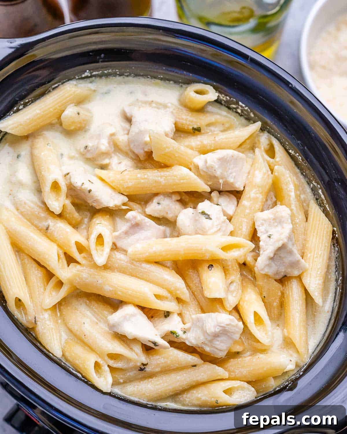 Chicken alfredo with penne pasta in a crock pot.