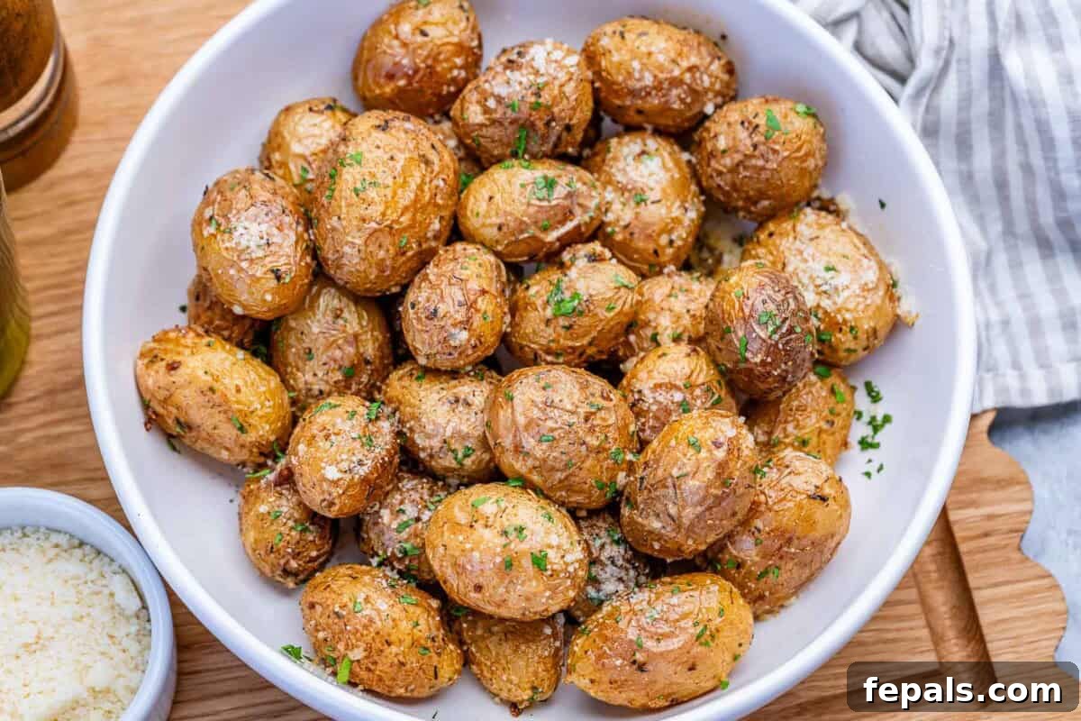 Air-fried potatoes in a round white bowl.