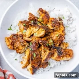 Weeknight Boneless Chicken Thigh Recipes 7 chopped sauteed chicken al pastor thighs over a bowl of rice.