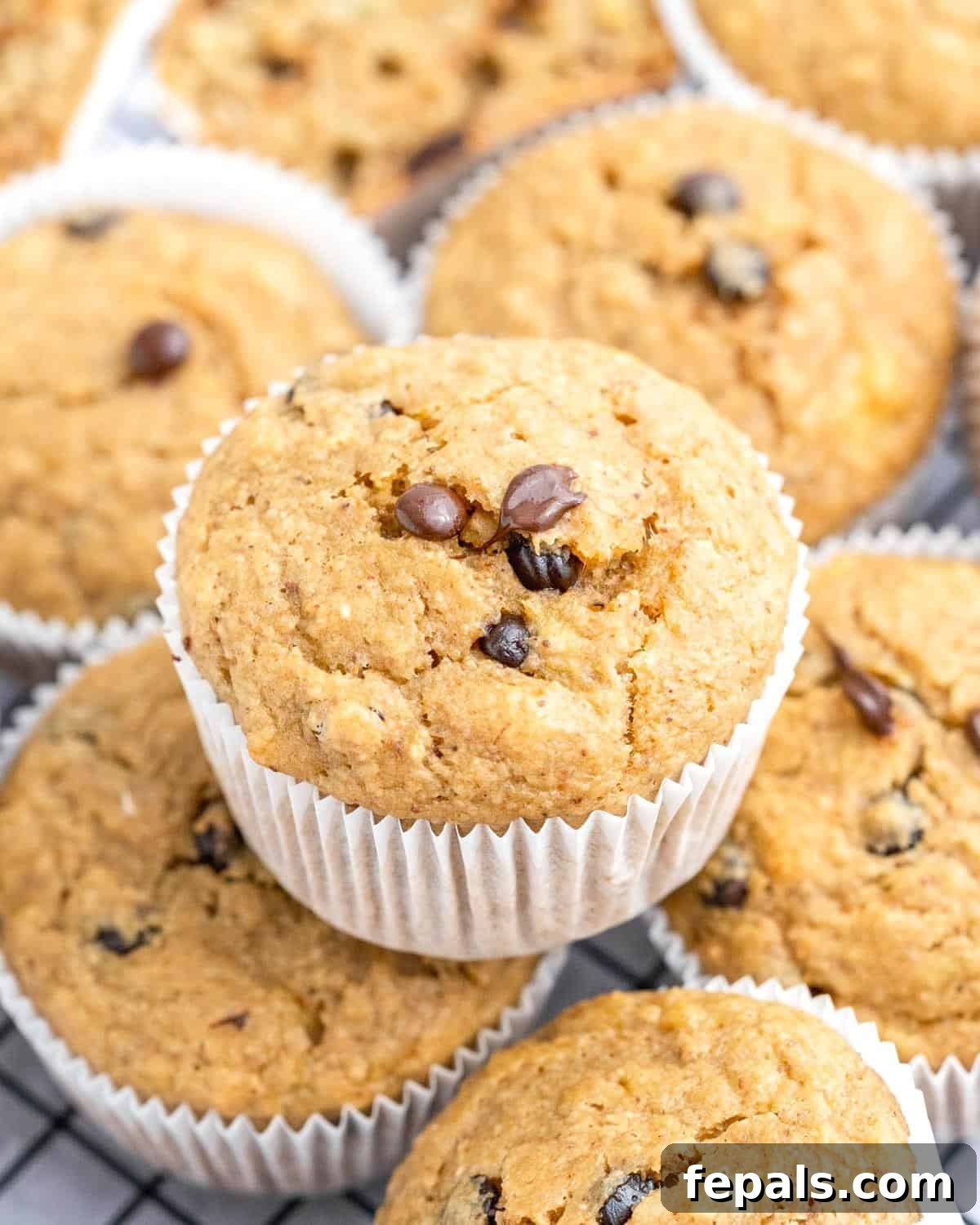 Muffins stacked over each other on a plate.