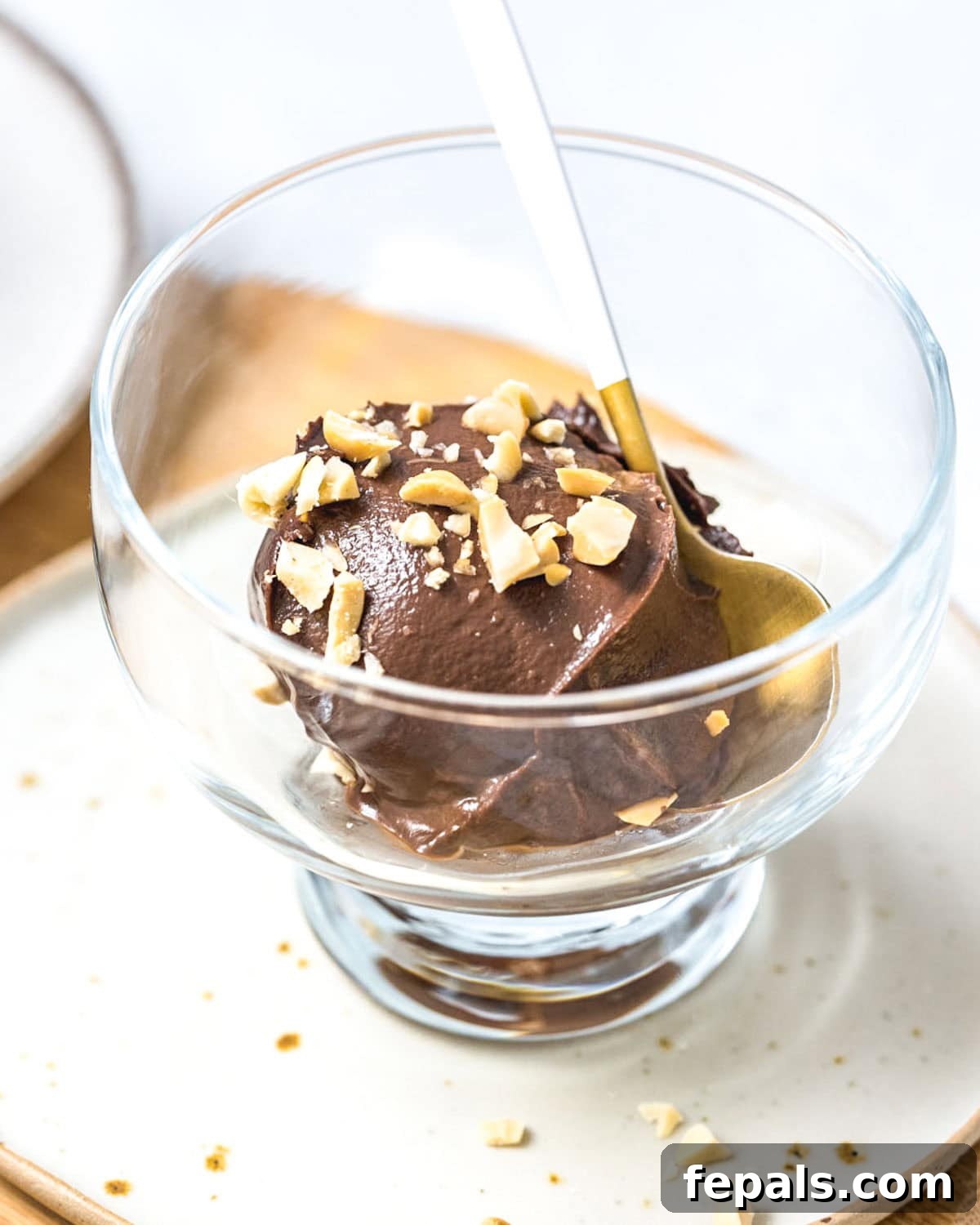 a small glass bowl with chocolate avocado ice cream.