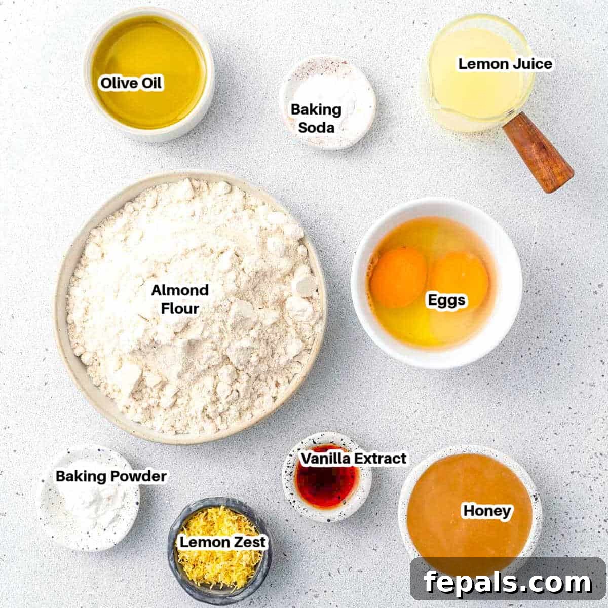 ingredients to make lemon cake with olive oil and almond flour.
