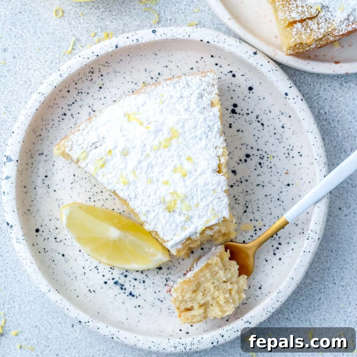 a slice of lemon cake on a plate.