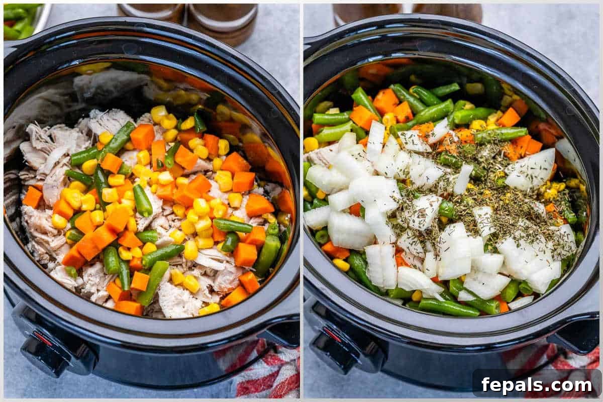 ingredients for chicken pot pie added to a slow cooker before cooking.