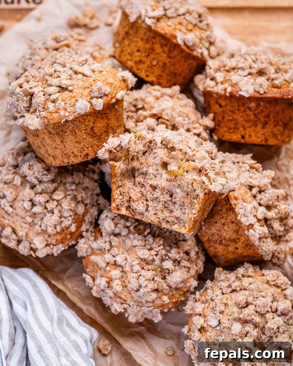 Cinnamon Streusel Muffins Recipe with Brown Sugar Crumble 7 cinnamon Streusel muffins packed over each other on a dish.