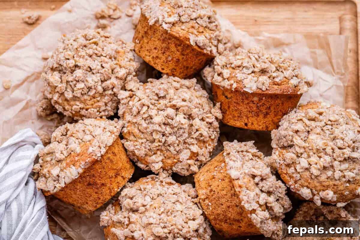 Cinnamon Streusel Muffins Recipe with Brown Sugar Crumble 8 cinnamon Streusel muffins stacked over each other.