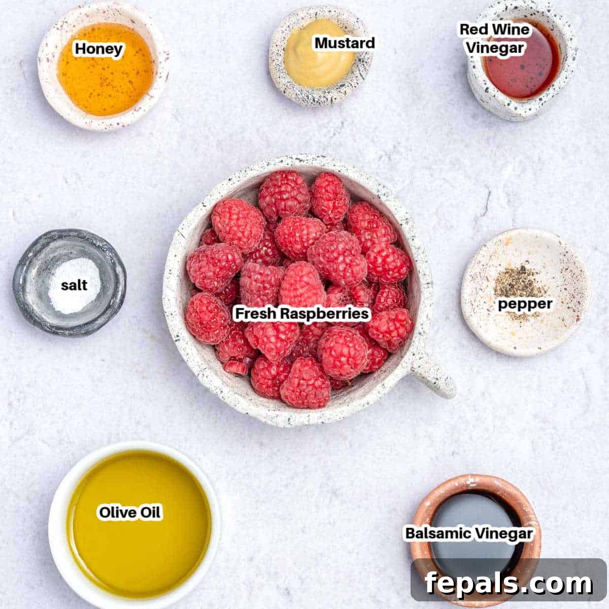 Ingredients to make raspberry vinaigrette dressing