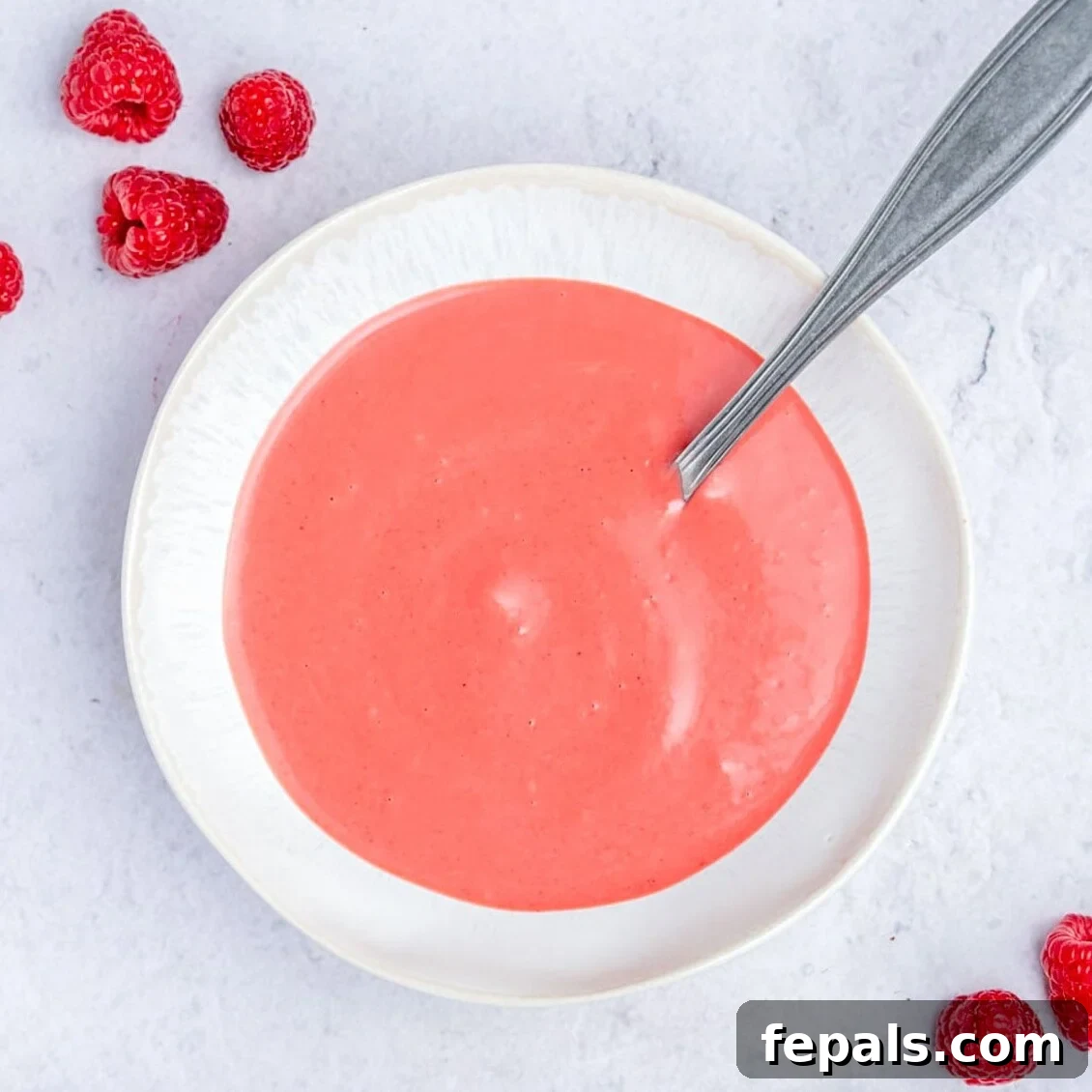 raspberry Vinaigrette dressing in a small bowl.