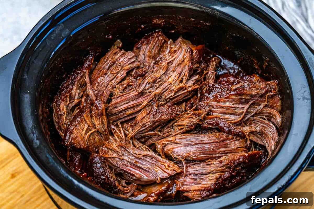 Shredded chuck roast, slow-cooked.