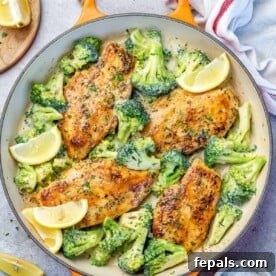top view chicken and broccoli recipe in an orange skillet