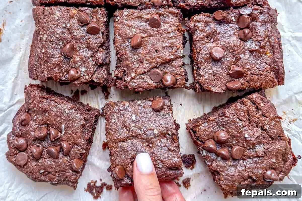 peanut butter brownie squares on parchment paper.